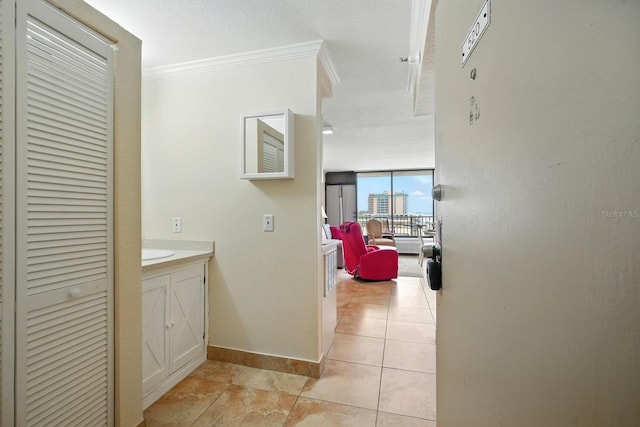 2043 S Atlantic Ave Unit 520, Daytona Beach, FL 32118 - hall featuring crown molding and a wall of windows
