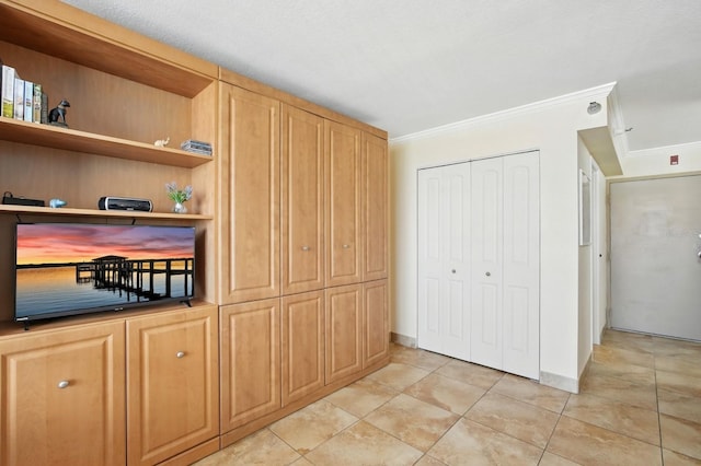 2043 S Atlantic Ave Unit 520, Daytona Beach, FL 32118 - interior space with crown molding, a closet, and light tile patterned floors