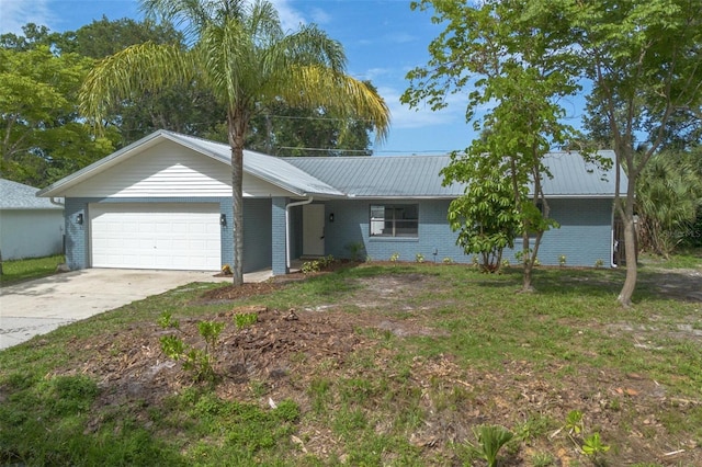 3117 Pine Tree Dr, Edgewater, FL 32141 - ranch-style house featuring an attached garage, brick siding, concrete driveway, and a metal roof