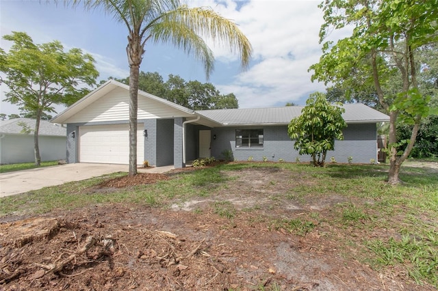 3117 Pine Tree Dr, Edgewater, FL 32141 - single story home featuring brick siding, an attached garage, concrete driveway, and a metal roof
