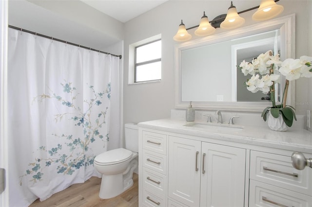 3117 Pine Tree Dr, Edgewater, FL 32141 - bathroom featuring vanity, wood finished floors, and a shower with curtain