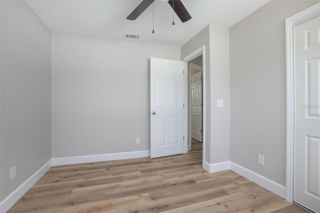 3117 Pine Tree Dr, Edgewater, FL 32141 - unfurnished bedroom featuring light wood-style floors and a ceiling fan