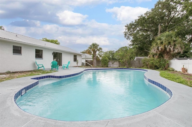 3117 Pine Tree Dr, Edgewater, FL 32141 - view of swimming pool with a fenced backyard and a patio