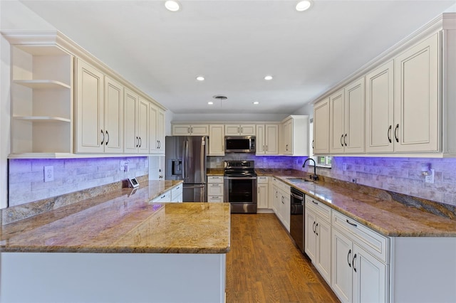 10 Venetian Cir, Port Orange, FL 32127 - kitchen featuring appliances with stainless steel finishes, open shelves, light stone countertops, a peninsula, and recessed lighting