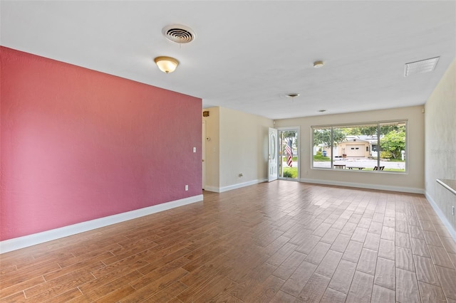 10 Venetian Cir, Port Orange, FL 32127 - unfurnished room featuring wood finished floors and baseboards