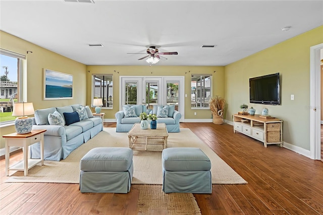 10 Venetian Cir, Port Orange, FL 32127 - living room featuring wood finished floors, a ceiling fan, and healthy amount of natural light