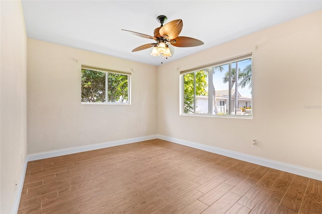 10 Venetian Cir, Port Orange, FL 32127 - empty room with wood finished floors and a ceiling fan
