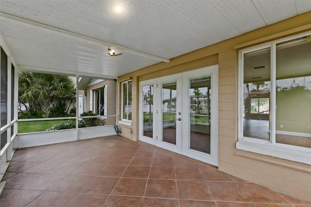 10 Venetian Cir, Port Orange, FL 32127 - unfurnished sunroom featuring french doors