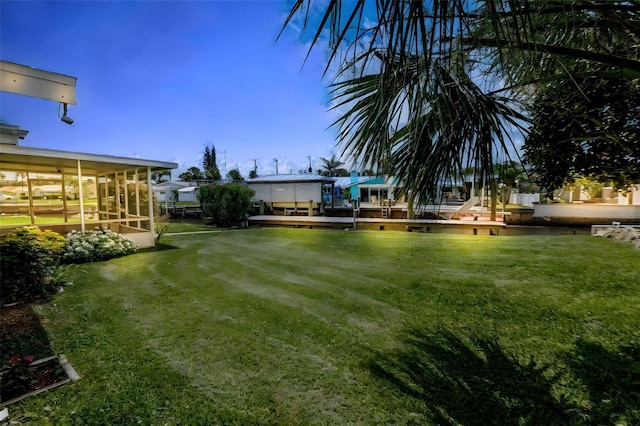 10 Venetian Cir, Port Orange, FL 32127 - view of green lawn featuring a sunroom