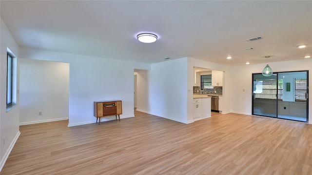 1017 Chippewa Trl, Daytona Beach, FL 32117 - unfurnished living room featuring light wood-style flooring and recessed lighting