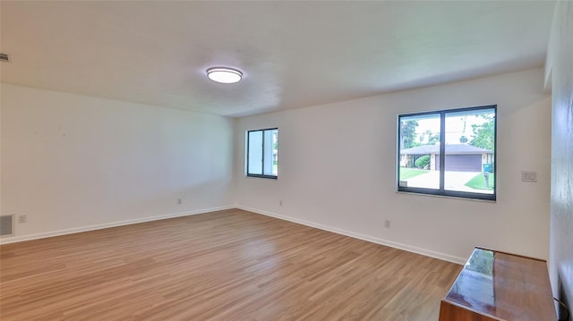 1017 Chippewa Trl, Daytona Beach, FL 32117 - unfurnished room with light wood-style floors and plenty of natural light