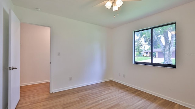 1017 Chippewa Trl, Daytona Beach, FL 32117 - empty room featuring light wood-type flooring, ceiling fan, and a smoke detector