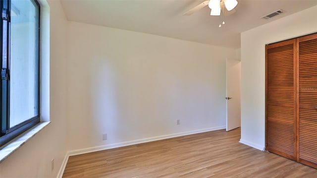 1017 Chippewa Trl, Daytona Beach, FL 32117 - unfurnished bedroom featuring a closet, light wood-style floors, and ceiling fan