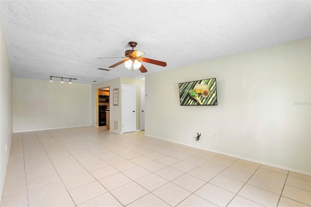 511 Polaris Loop Unit 105, Casselberry, FL 32707 - unfurnished room with ceiling fan, a textured ceiling, light tile patterned floors, and track lighting