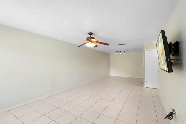 511 Polaris Loop Unit 105, Casselberry, FL 32707 - empty room with ceiling fan, a textured ceiling, and light tile patterned floors