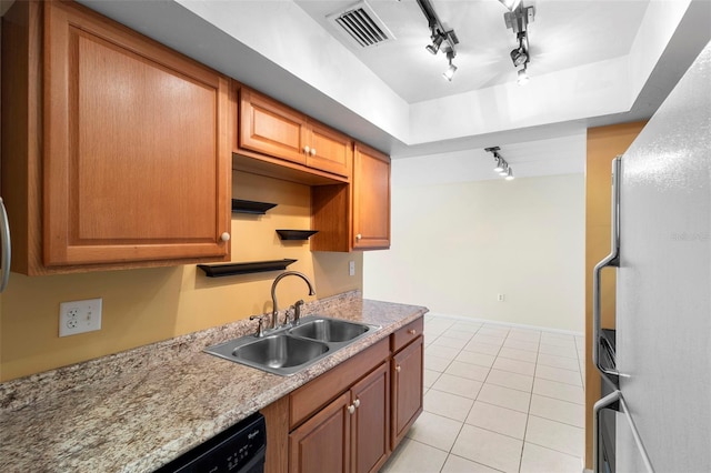 511 Polaris Loop Unit 105, Casselberry, FL 32707 - kitchen featuring rail lighting, freestanding refrigerator, light tile patterned flooring, and brown cabinetry