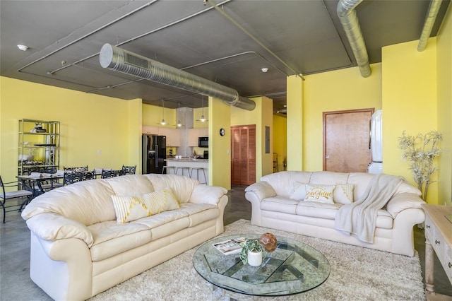 208 Wall St Unit 204, Daytona Beach, FL 32114 - living room featuring concrete flooring