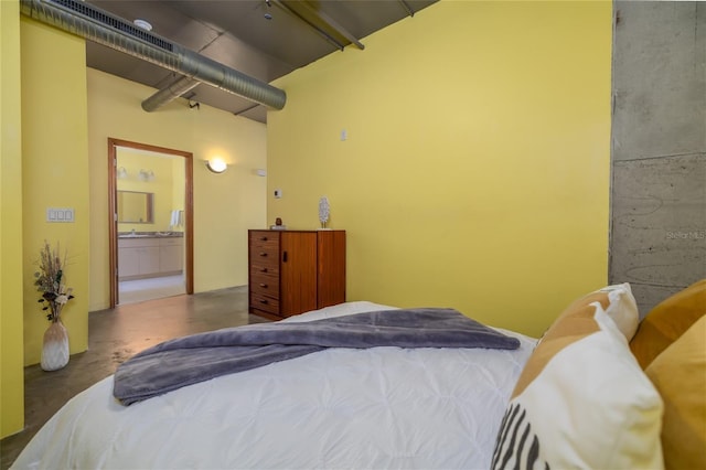 208 Wall St Unit 204, Daytona Beach, FL 32114 - bedroom with finished concrete flooring and connected bathroom