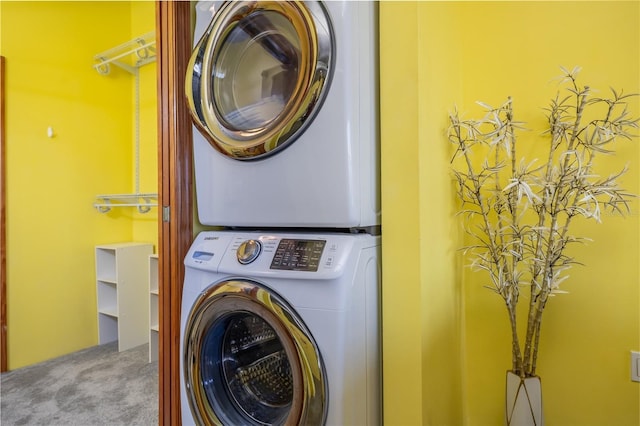 208 Wall St Unit 204, Daytona Beach, FL 32114 - washroom with stacked washer / drying machine and carpet floors