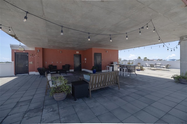 208 Wall St Unit 204, Daytona Beach, FL 32114 - view of patio with an outdoor hangout area and a bar