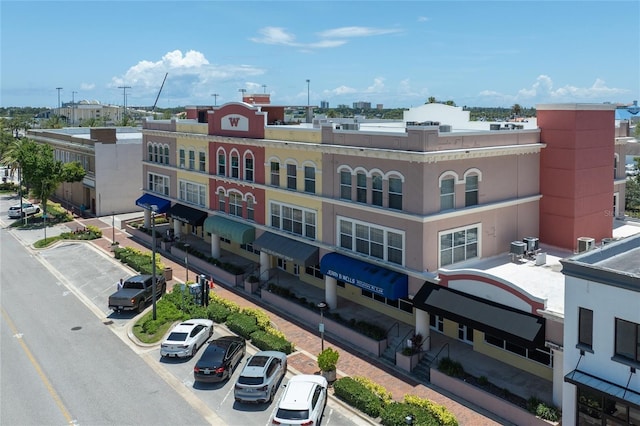 208 Wall St Unit 204, Daytona Beach, FL 32114 - view of building exterior featuring uncovered parking