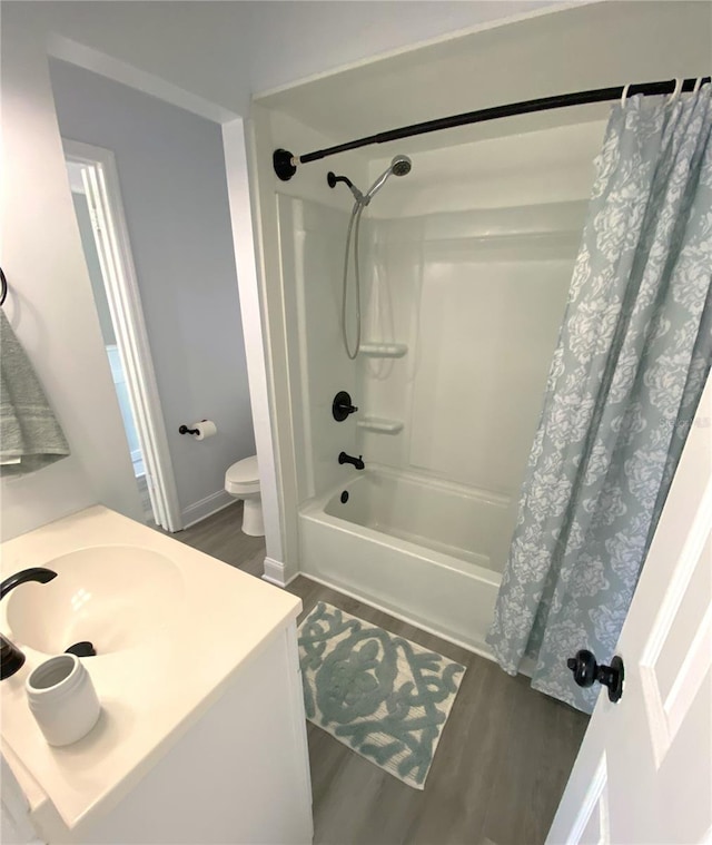 4786 S Atlantic Ave Unit 3, Ponce Inlet, FL 32127 - bathroom with wood finished floors, shower / bath combination with curtain, and vanity