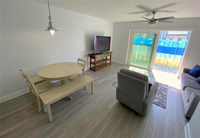 4786 S Atlantic Ave Unit 3, Ponce Inlet, FL 32127 - living room with a ceiling fan and light wood-style flooring