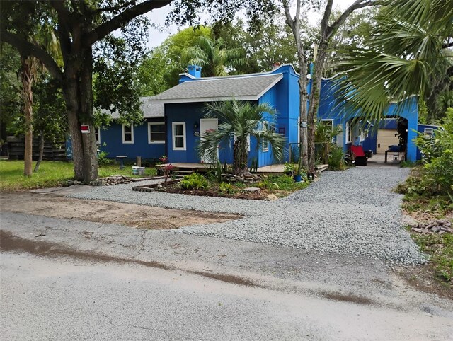 615 Weber Ave, Daytona Beach, FL 32114 - view of front of house with gravel driveway and roof with shingles