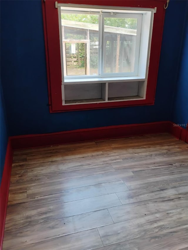 615 Weber Ave, Daytona Beach, FL 32114 - unfurnished room featuring healthy amount of natural light and wood finished floors