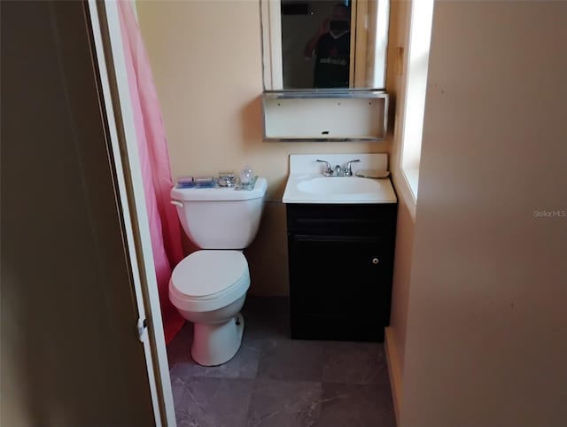 615 Weber Ave, Daytona Beach, FL 32114 - bathroom with vanity and toilet
