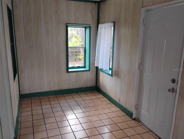 615 Weber Ave, Daytona Beach, FL 32114 - spare room with baseboards and light tile patterned flooring