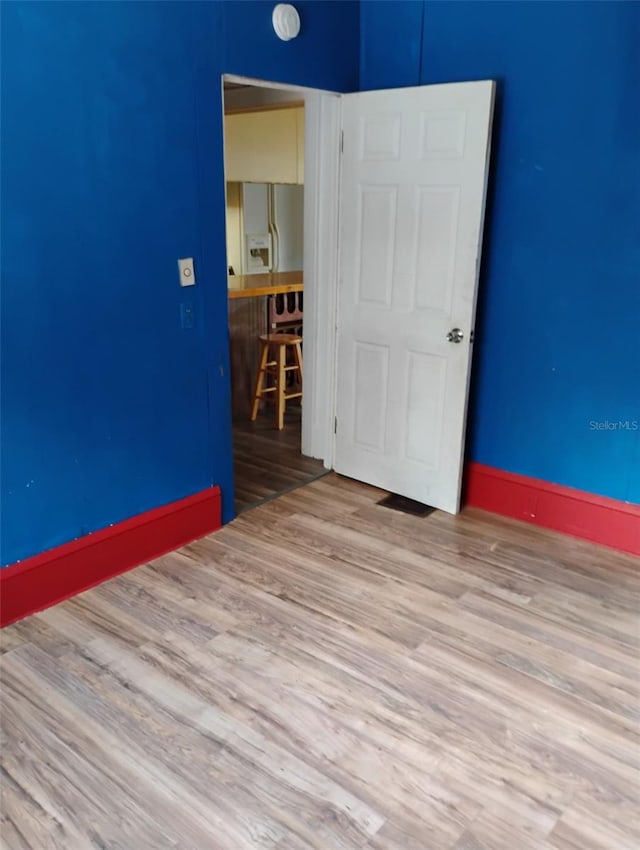 615 Weber Ave, Daytona Beach, FL 32114 - empty room with wood finished floors and baseboards