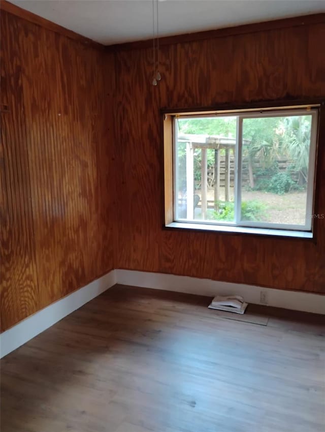615 Weber Ave, Daytona Beach, FL 32114 - spare room with wood finished floors and wood walls