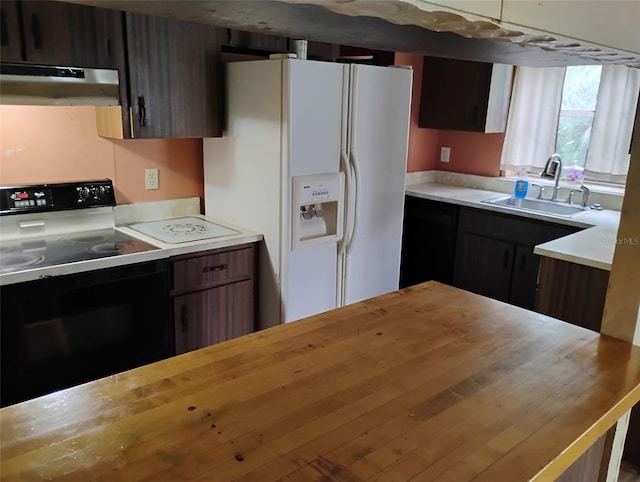 615 Weber Ave, Daytona Beach, FL 32114 - kitchen with white refrigerator with ice dispenser, electric range, range hood, and butcher block countertops