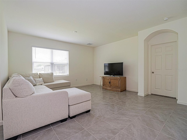 1915 Ganyard Ave SW, Palm Bay, FL 32908 - living room with light tile patterned floors and baseboards