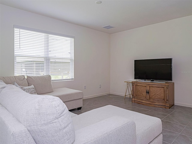 1915 Ganyard Ave SW, Palm Bay, FL 32908 - tiled living room featuring baseboards