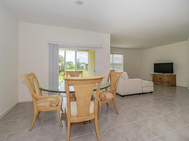 1915 Ganyard Ave SW, Palm Bay, FL 32908 - dining room featuring light tile patterned floors and baseboards
