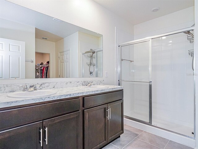 1915 Ganyard Ave SW, Palm Bay, FL 32908 - bathroom featuring a shower stall, a spacious closet, and double vanity