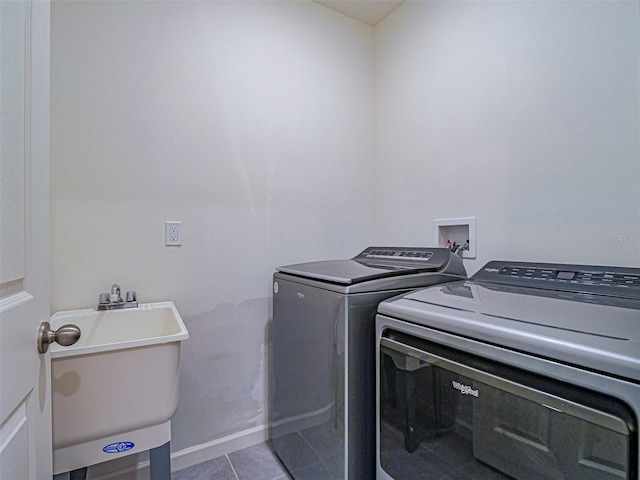 1915 Ganyard Ave SW, Palm Bay, FL 32908 - laundry room featuring washing machine and dryer and tile patterned flooring