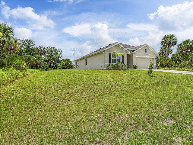 1915 Ganyard Ave SW, Palm Bay, FL 32908 - view of front of property featuring driveway, a front yard, and a garage