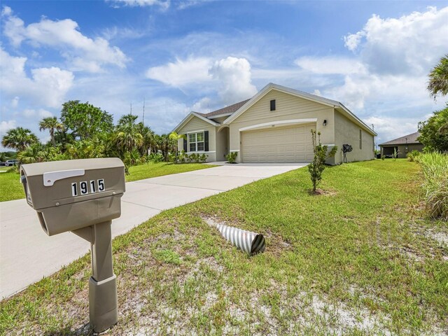1915 Ganyard Ave SW, Palm Bay, FL 32908 - ranch-style house with a front lawn, an attached garage, driveway, and stucco siding