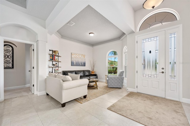 2825 S Asciano Ct, New Smyrna Beach, FL 32168 - foyer entrance featuring light tile patterned floors and a textured ceiling
