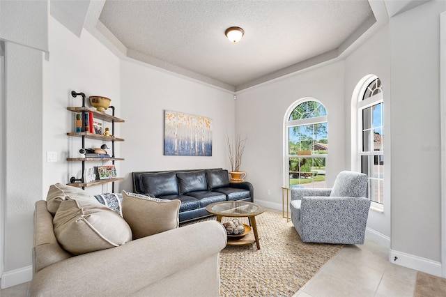 2825 S Asciano Ct, New Smyrna Beach, FL 32168 - tiled living area with baseboards and a textured ceiling