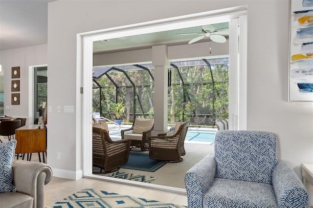 2825 S Asciano Ct, New Smyrna Beach, FL 32168 - dining space with a ceiling fan, a sunroom, and tile patterned flooring
