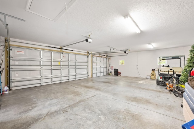 2825 S Asciano Ct, New Smyrna Beach, FL 32168 - garage featuring a garage door opener and concrete block wall