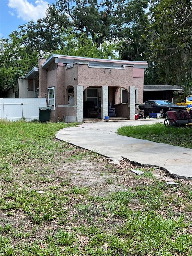 517 Wallace St, Daytona Beach, FL 32114 - rear view of house featuring stucco siding