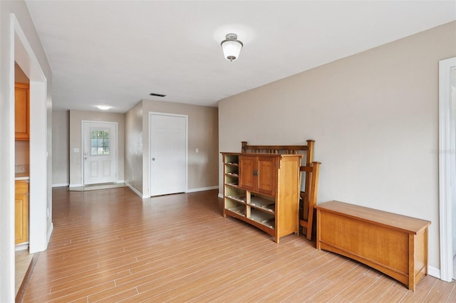 5759 Dogwood Rd, Port Orange, FL 32127 - unfurnished living room with light wood-style floors and baseboards
