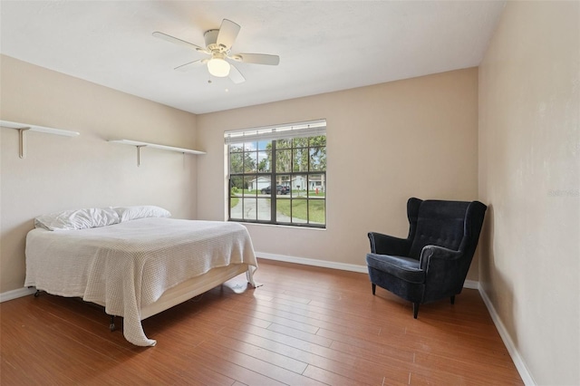 5759 Dogwood Rd, Port Orange, FL 32127 - bedroom with wood finished floors and ceiling fan