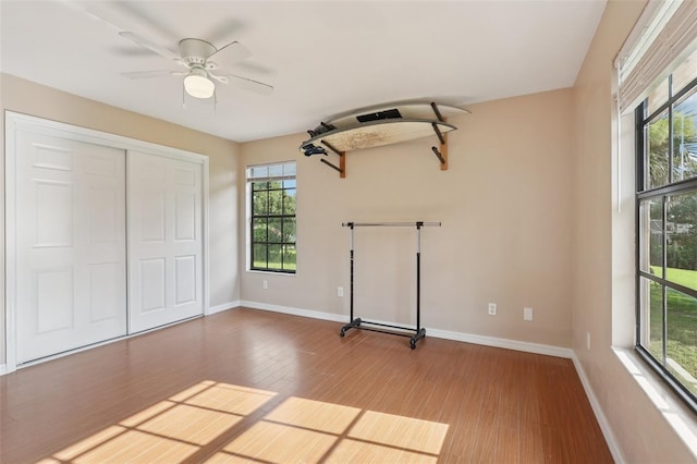 5759 Dogwood Rd, Port Orange, FL 32127 - unfurnished bedroom with wood finished floors, a closet, and ceiling fan