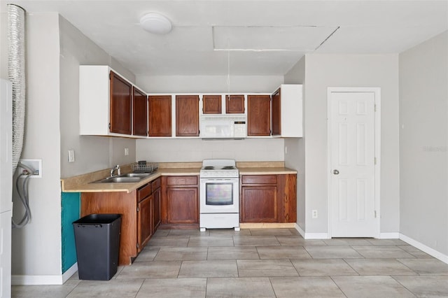 5759 Dogwood Rd, Port Orange, FL 32127 - kitchen featuring white appliances, light countertops, and brown cabinetry